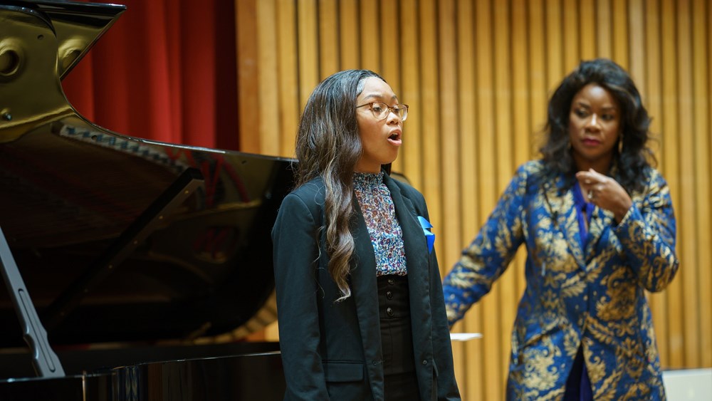Denyce Graves (at right) coaches soprano Elise Golden at the launch of her foundation’s Shared Voices program. (photo: Matt Mendelsohn Photography)