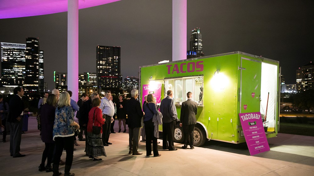 Audience members at Austin Opera line up for tacos.