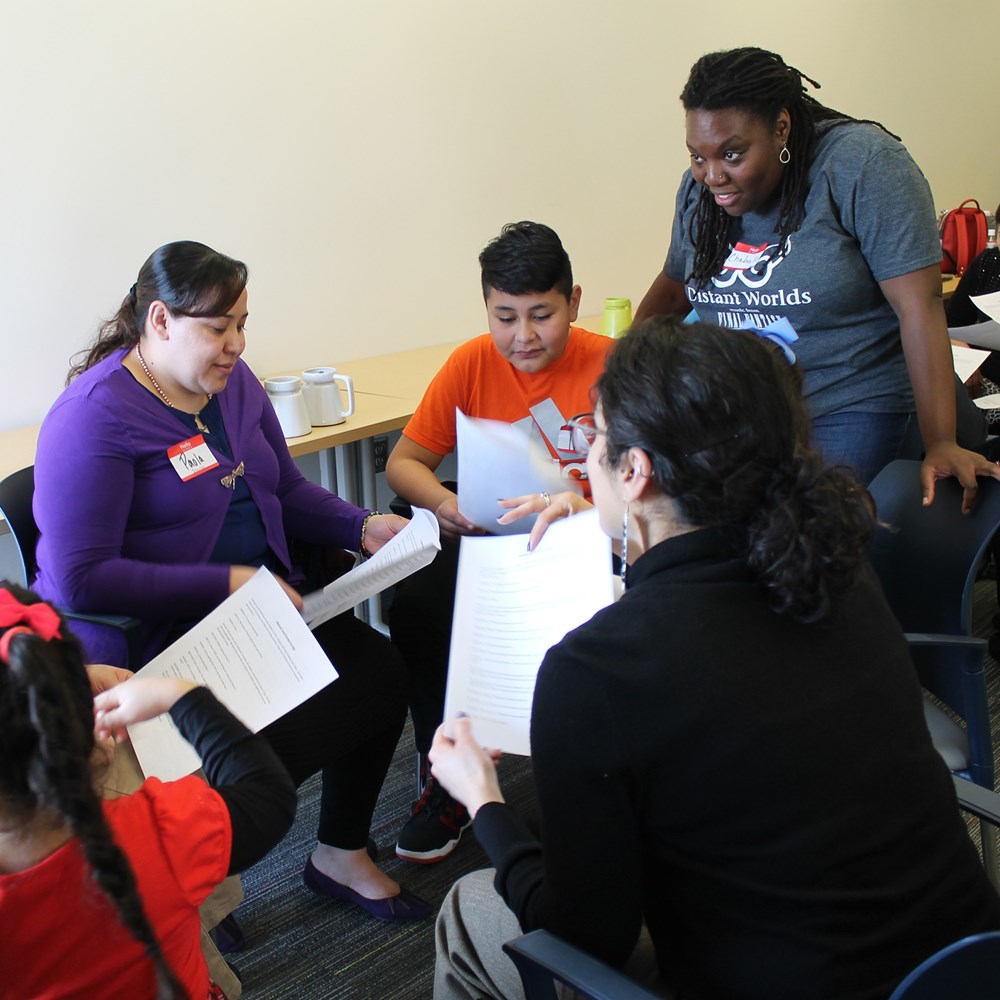 Chabrelle Williams (upper right), a Holland Fellow at Opera Omaha, with families at the Learning Community Center of South Omaha