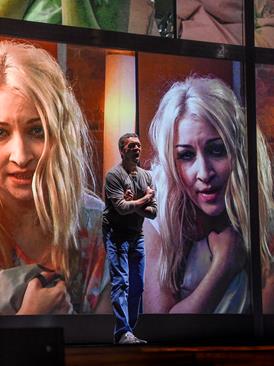 Roderick Williams and Kate Miller-Heidke (on-screen) in Michel van der Aa and David Mitchell’s Sunken Garden at The Dallas Opera