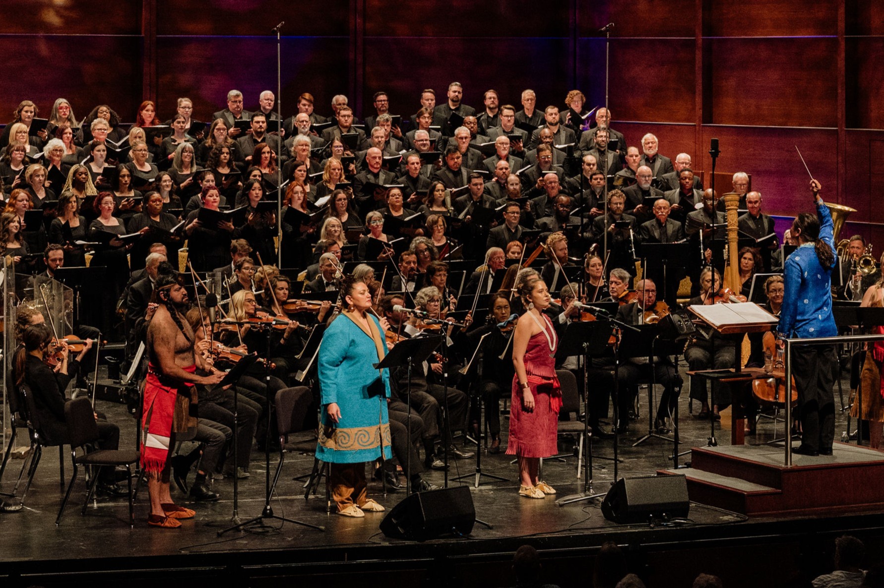 Hugo Vera, Kirsten C. Kunkle, and Kate Morton with conductor Tian Hui Ng in Loksi’ Shaali’, by Jerod Impichchaachaaha’ Tate, presented by the Canterbury Voices and the Oklahoma City Philharmonic in 2024 (photo: courtesy of Oh Joy Photography and Canterbury Voices) 