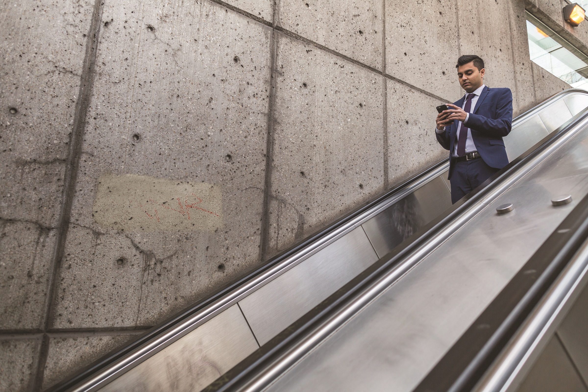 Man on escalator