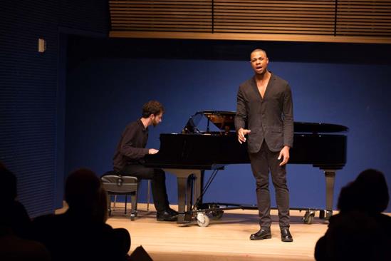 Davóne Tines performs at an Opera Center event featuring composer Matthew Aucoin (at piano)