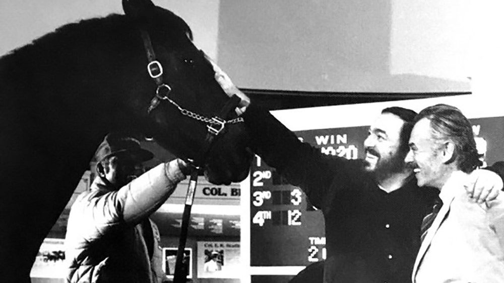 Kentucky Opera presents Luciano Pavarotti with a horse.
