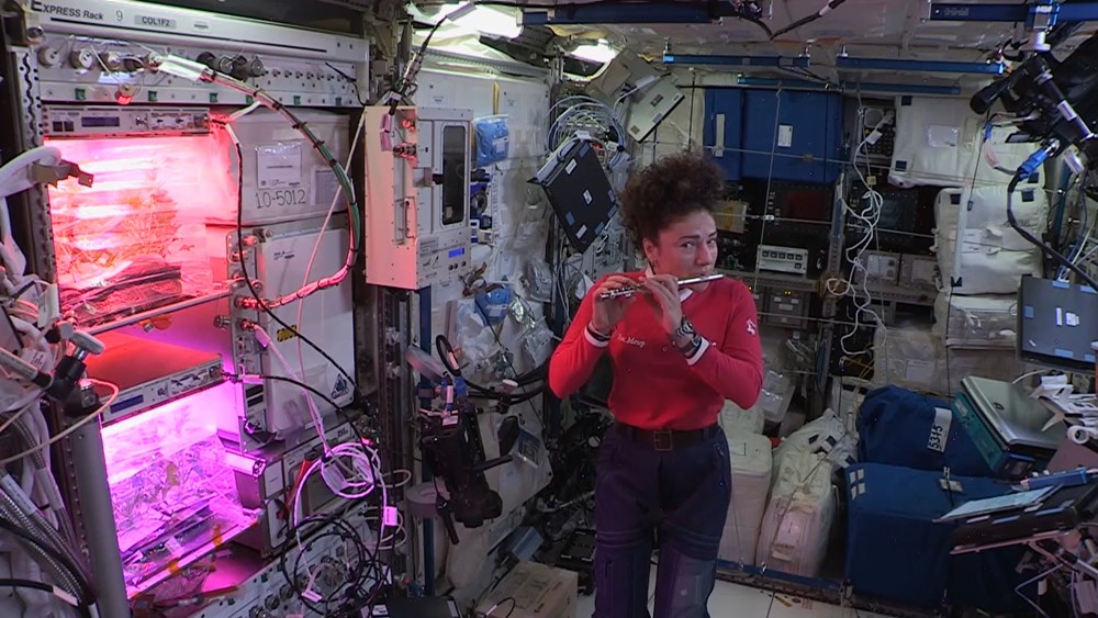 Astronaut Jessica Meir plays the piccolo on the International Space Station in 2019. (photo: NASA)